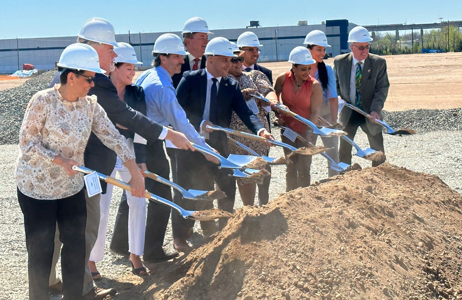 Public and private partners at a redevelopment groundbreaking